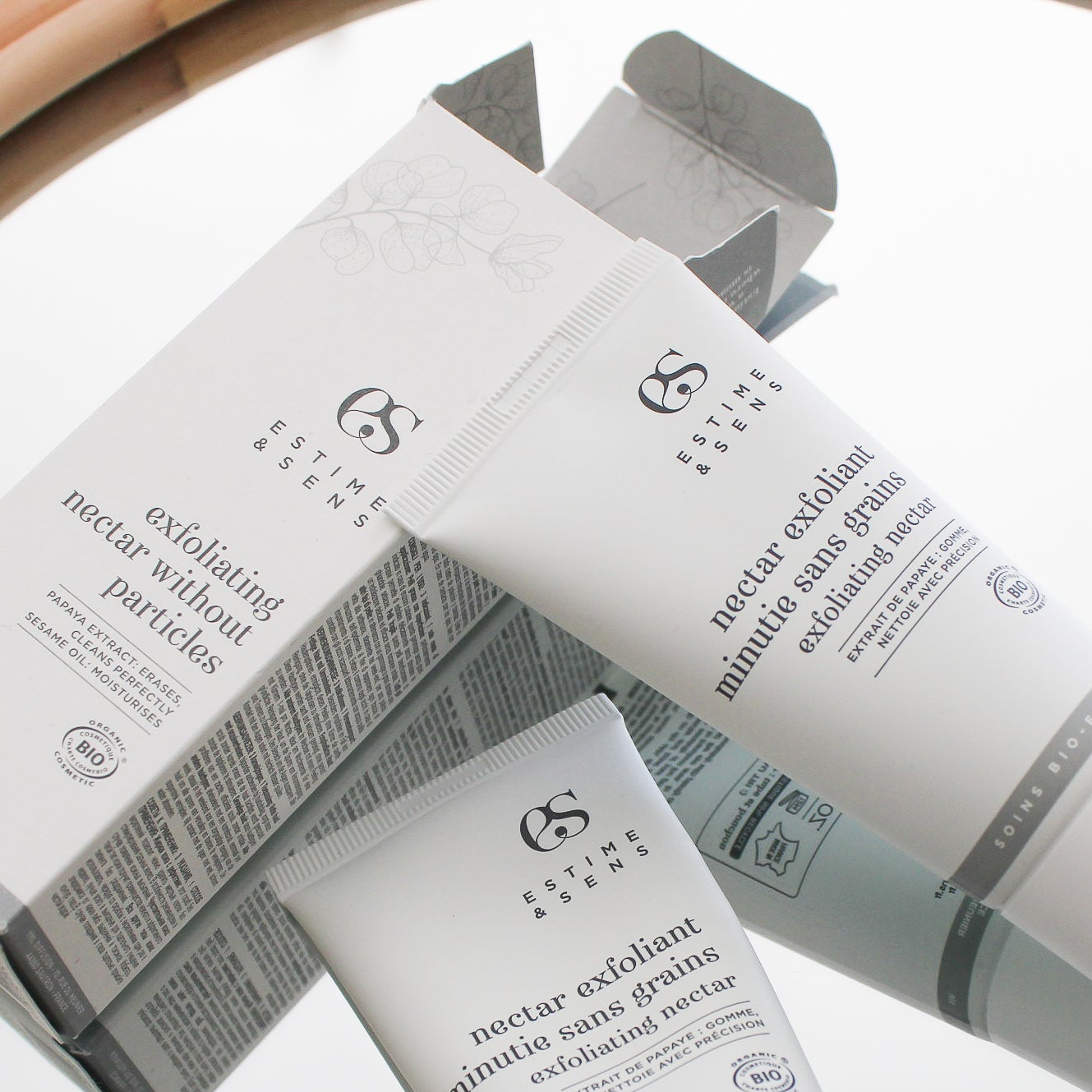 Cosmetic packaging with 'Estimee' branding on a white background