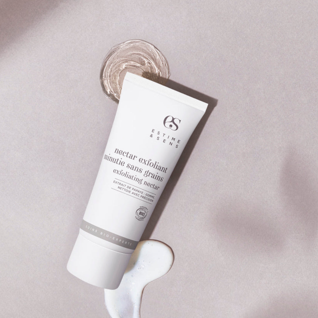 Skincare tube on a textured beige background